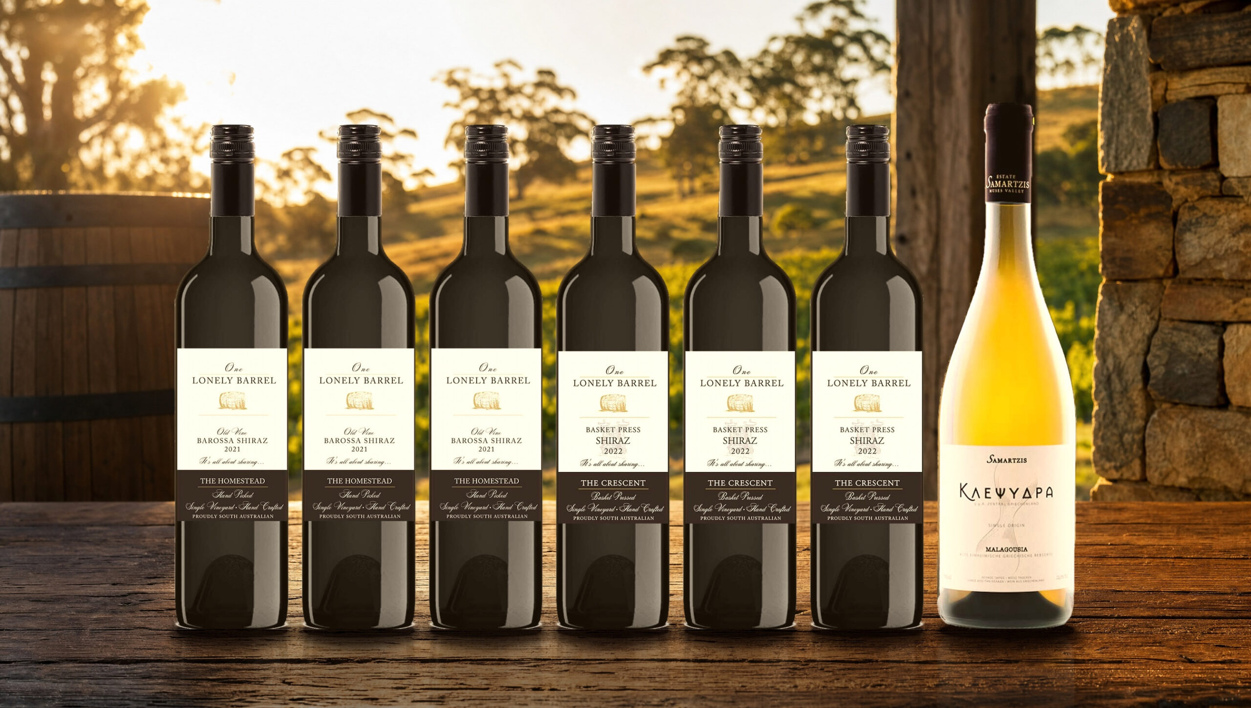Six bottles of One Lonely Barrel wine on a barrel-room table